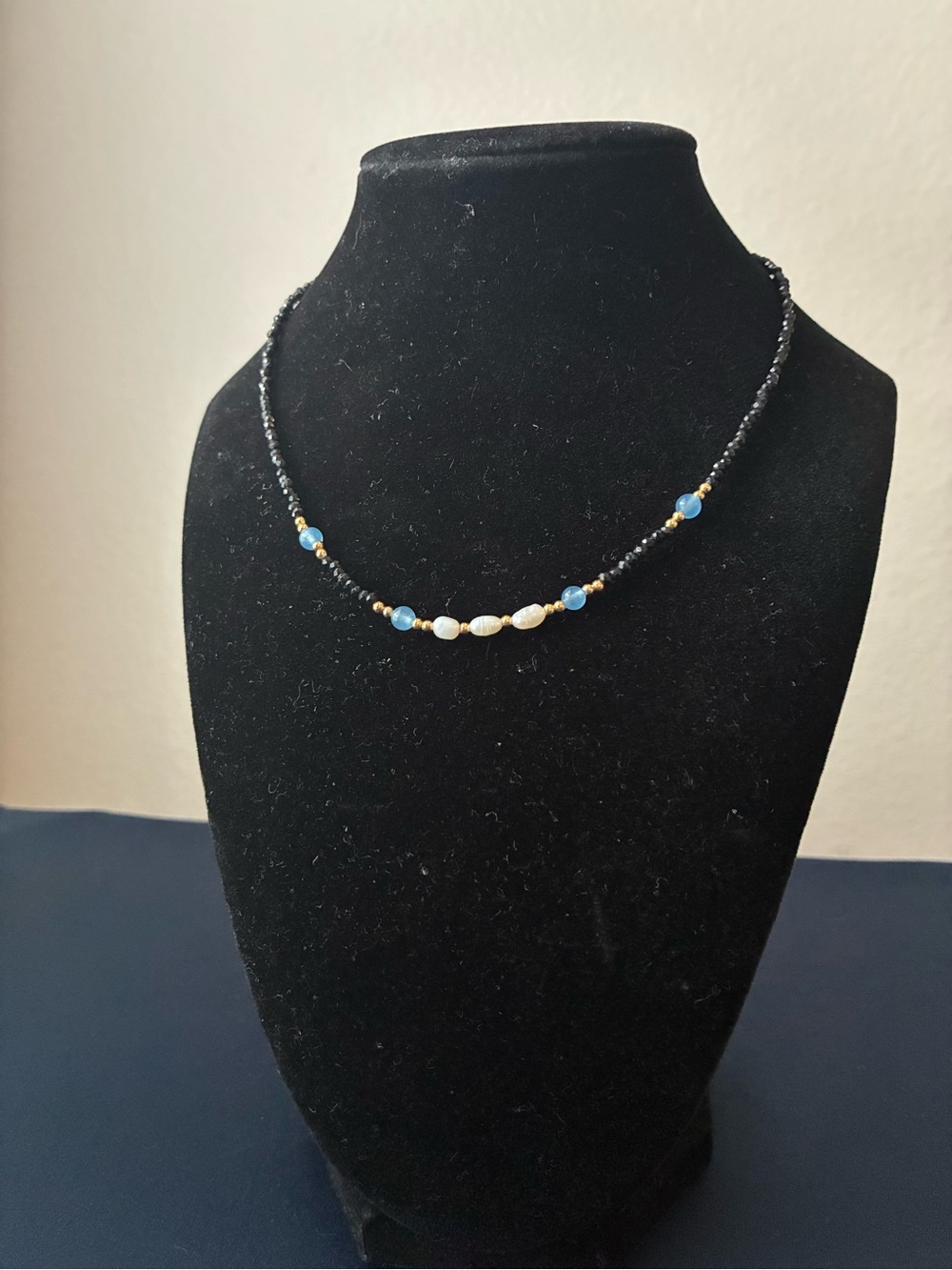 Black Beaded Necklace with Blue and White Accents 16”
